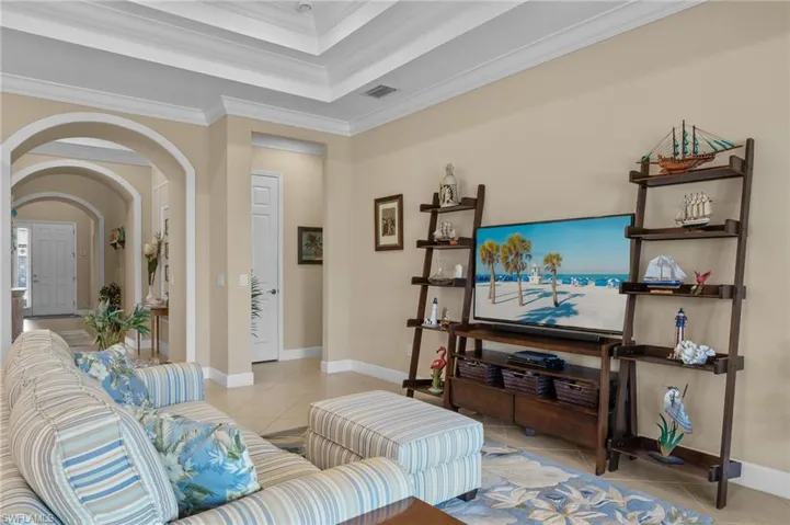 Tiled living room with crown molding