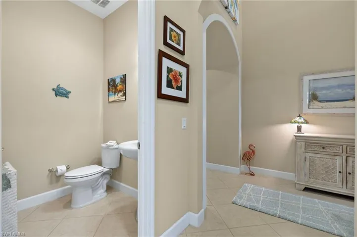 Bathroom featuring tile patterned flooring and toilet