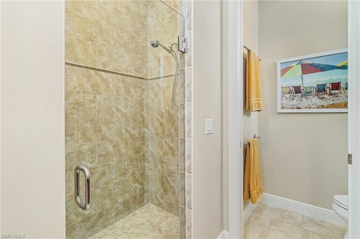 Walk in shower and separate water closet.