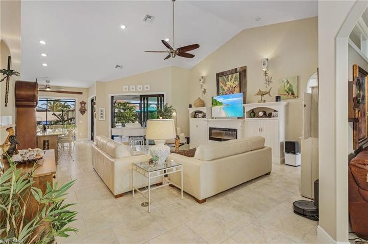 Entry/Foyer to home with Study on the right and 3 sets of sliders to the pool and lanai.