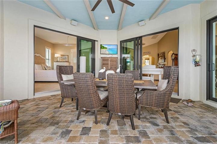 Covered entertaining/dining area in lanai.  Pocket sliders to guest bedroom #2, and sliders to Living Room and Dining Room.