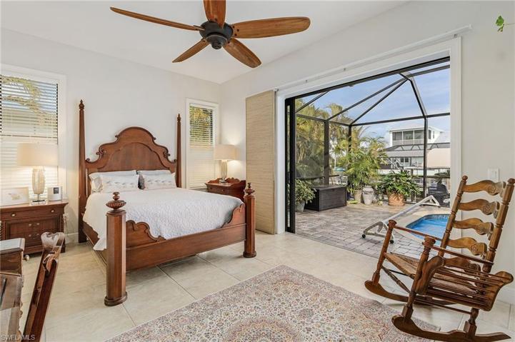 Master Bedroom with pocket sliders to pool and lanai.