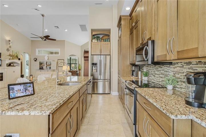 Large island with cabinets on both sides.