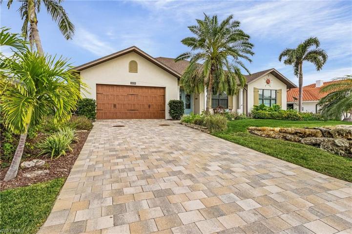 Oversized 2 car garage, driveway with pavers.  Garage is air conditioned.