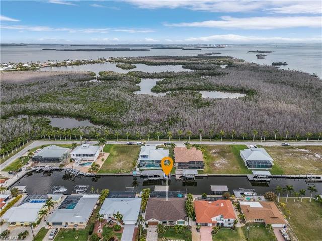 This home has very quick access to the ICW, Outer Islands and Ft. Myers Beach is in the background, along with the Gulf of Mexico.