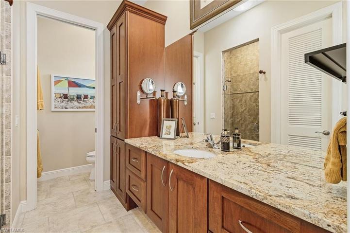 Master Bath with custom cabinetry and lights under the cabinets.