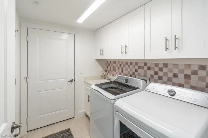 Laundry room washer and dryer and utility tub