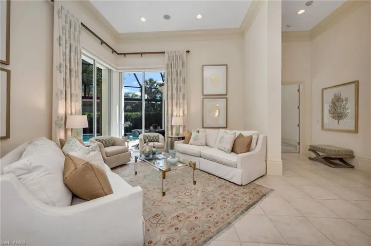 Living room with Owner's Suite and guest bedroom to the right.