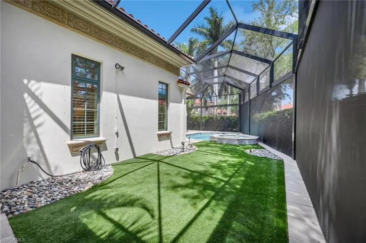 ...and your furry pets will also have a backyard haven, with this custom "dog park," equipped with artificial grass and drainage system.