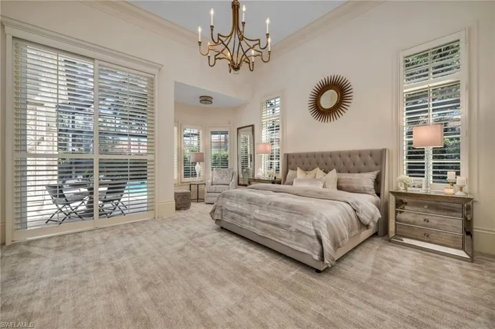 The Owner's Suite is very spacious, with a sitting area that could be the perfect place for a desk for working...and gazing out to your pool!