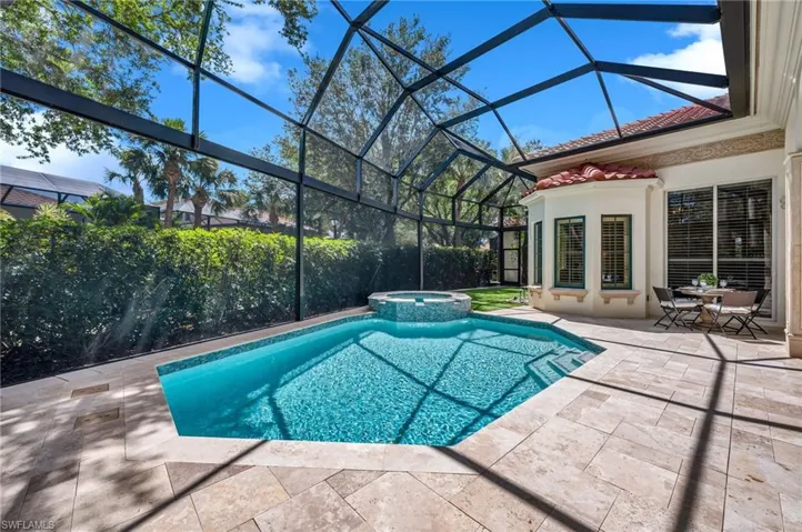 The pool area has picture-window screens, which make this already large lanai, seem even more spacious! The "dog park" is located just past the spa.
