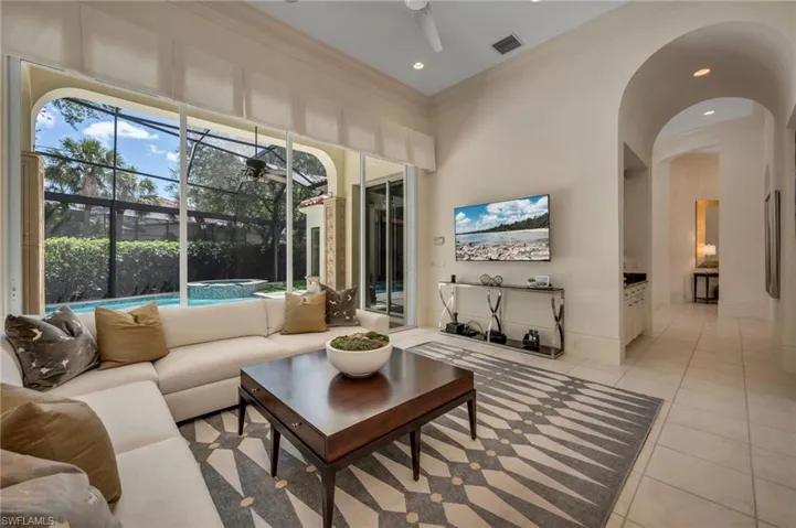 The family room is spacious and has great views to the large pool and spa outside.