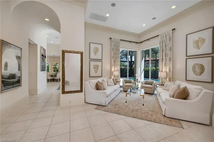 As you enter this residence, you will be greeted with tall ceilings, understated elegant interiors, and plenty of sunshine spilling in.