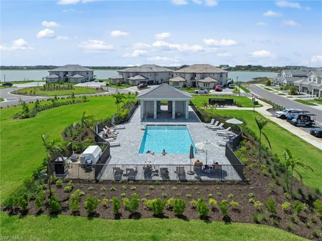 Community pool with a patio, a water view, a gazebo, and a residential view