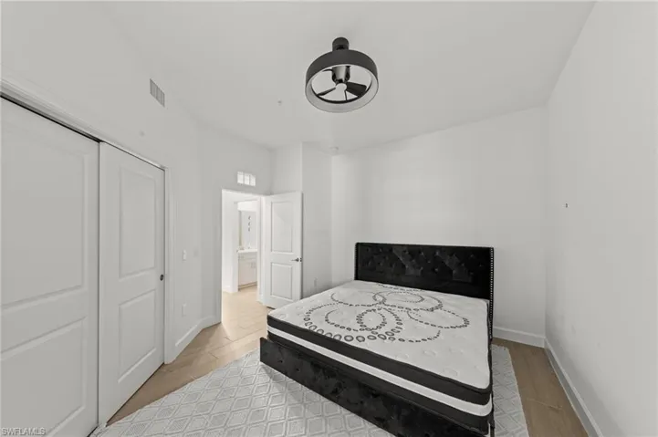 Bedroom featuring a closet and light wood finished floors