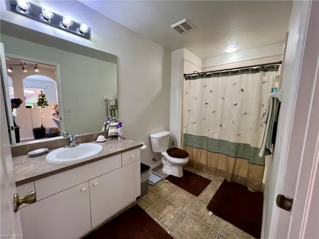 Bathroom with vanity and toilet