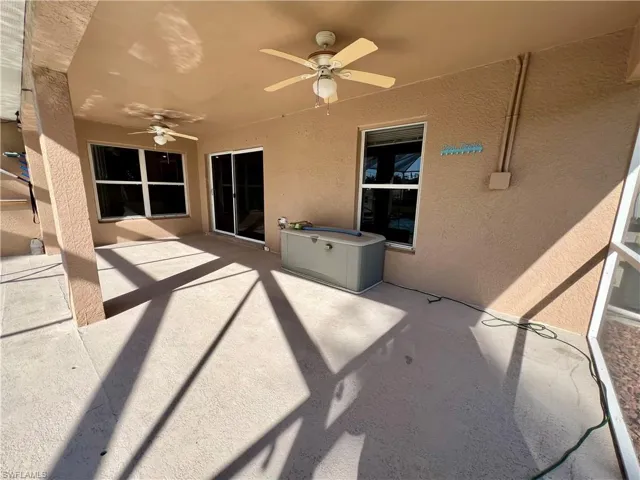 View of covered patio featuring ceiling fan