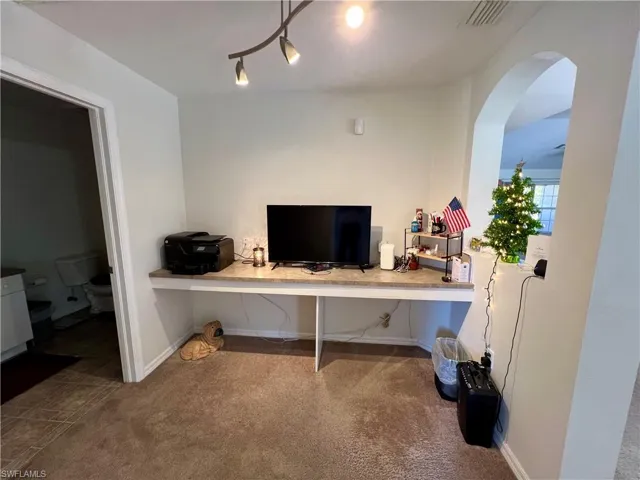 Office area featuring built in desk