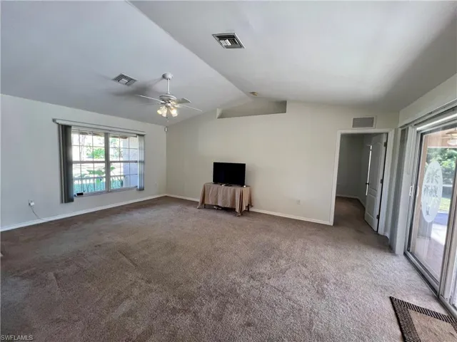 Living room , a wealth of natural light, ceiling fan, and cathedral ceiling