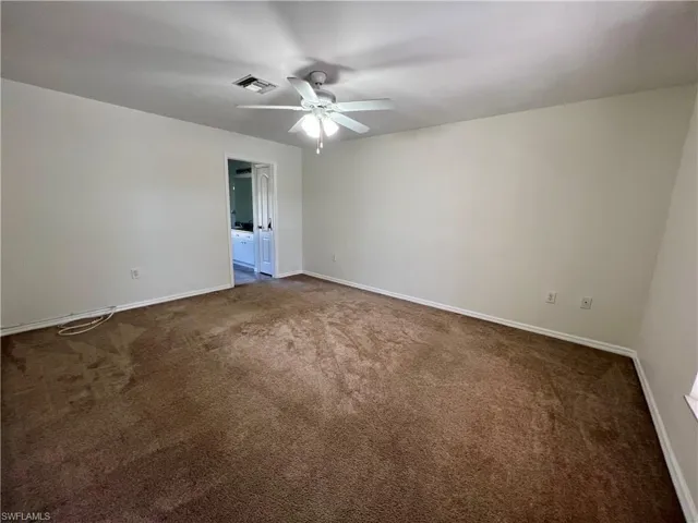 Primary bedroom with ceiling fan