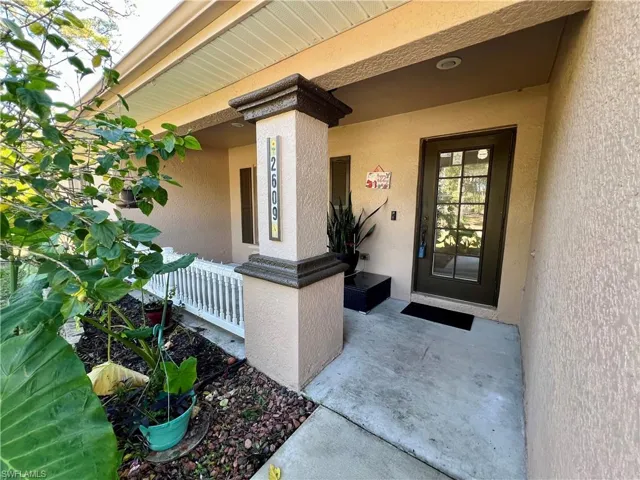 Entrance to property with covered porch