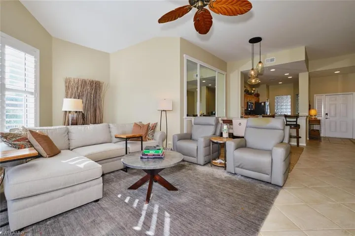 Tiled living room with ceiling fan