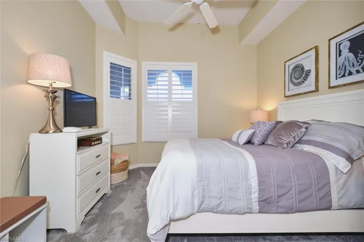 Bedroom featuring carpet and ceiling fan