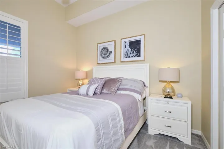Bedroom with carpet flooring and baseboards
