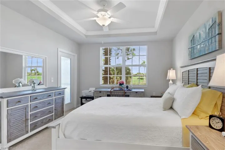 Bedroom featuring access to exterior, ceiling fan, crown molding, and light colored carpet