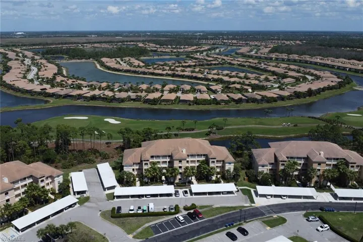 Aerial overview of property's location with a local golf course and nearby suburban area