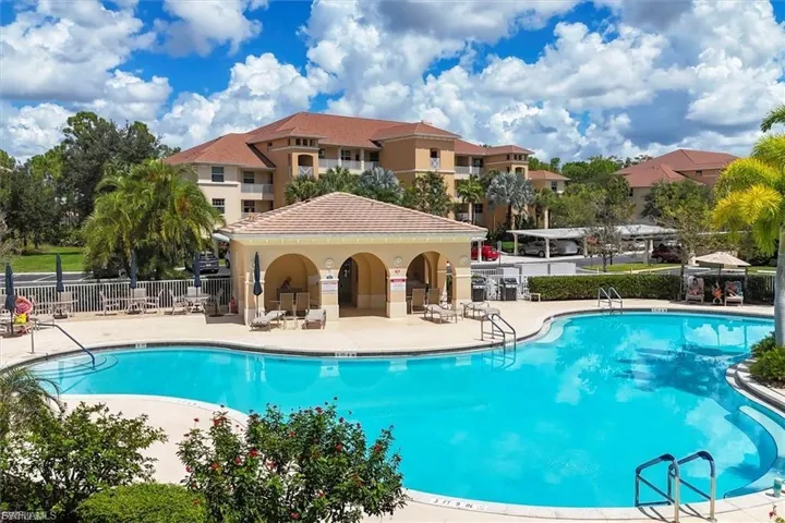 Community pool with a patio area