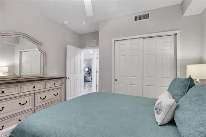 Bedroom featuring a closet and a ceiling fan