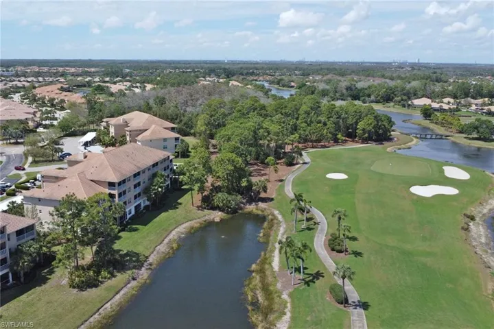 Aerial overview of property's location featuring a large body of water and nearby suburban area