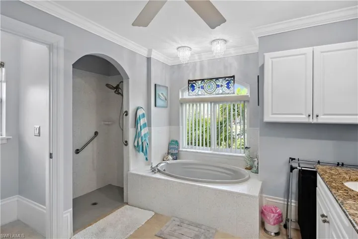 The spacious layout and modern fixtures make the walk-in shower a truly indulgent part of this luxurious bathroom.