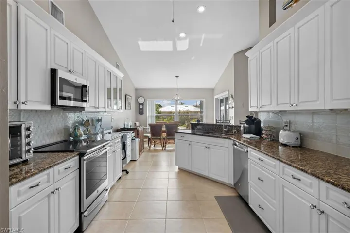 The kitchen includes plenty of storage, efficient workflow, and subtle design touches that make it both inviting and highly practical—perfect for everything from daily meals to entertaining guests.