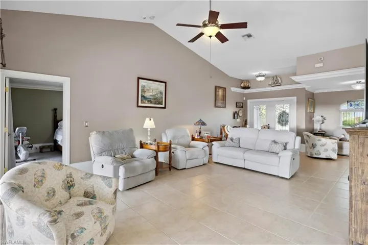 A living area with a view of the foyer typically creates a welcoming, open atmosphere.