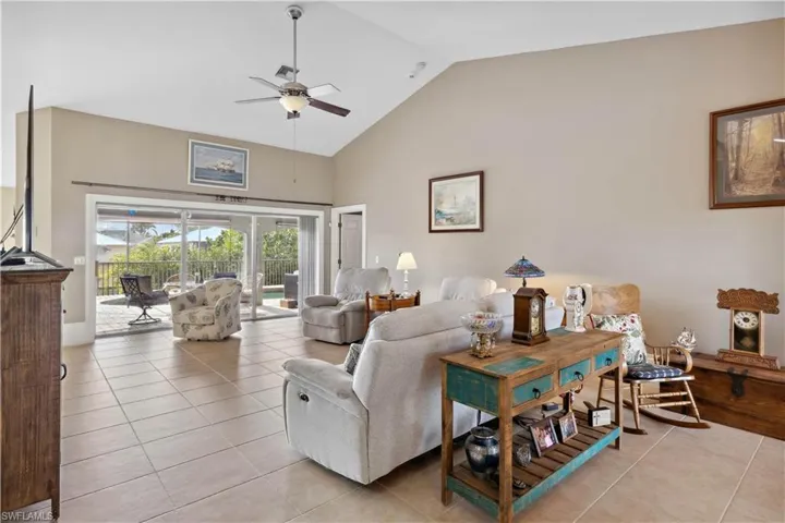 ChatGPT said:The living area is a tranquil retreat, seamlessly blending indoor comfort with the beauty of the outdoors. Large sliding doors open up to reveal a stunning view of the pool.