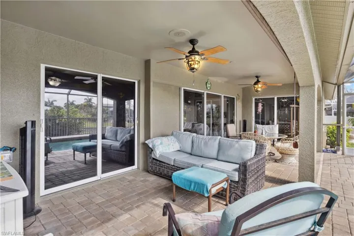With a covered roof providing shade, the lanai is equipped with comfortable seating, ideal for enjoying the breeze or dining al fresco.
