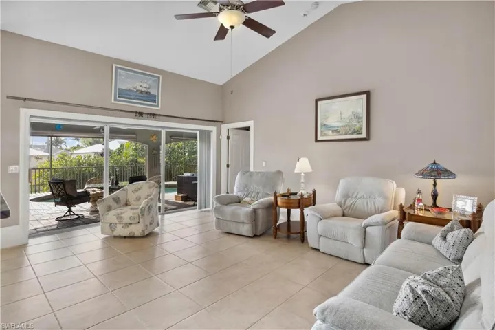 The living room is a spacious and inviting centerpiece of the home, featuring an open layout, high ceilings, and abundant natural light.