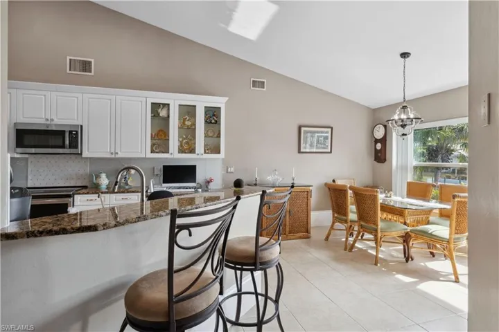 The kitchen and dining room are seamlessly integrated, creating a functional yet stylish space ideal for both cooking and entertaining.
