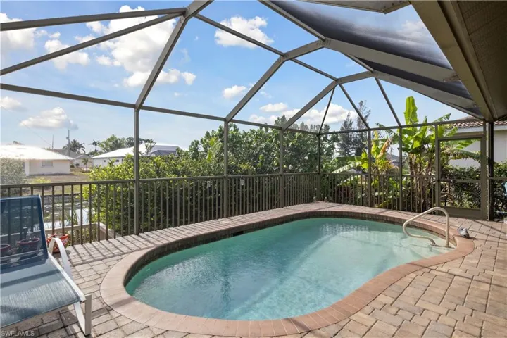 The pool area is designed for both relaxation and entertainment, with comfortable lounge chairs and a spacious deck for sunbathing or enjoying the outdoors.