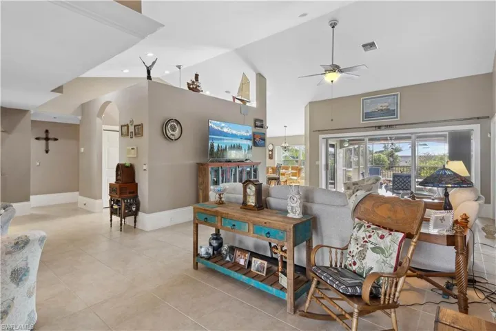 As you enter the room, the foyer acts as a transitional space, offering a glimpse into the heart of the home.