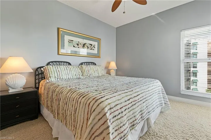 Bedroom featuring carpet and ceiling fan