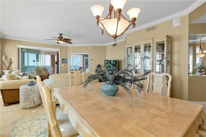Dining space featuring ornamental molding, healthy amount of natural light, and ceiling fan