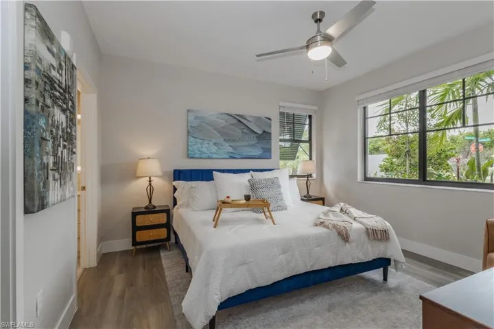 Bedroom with wood finished floors and a ceiling fan