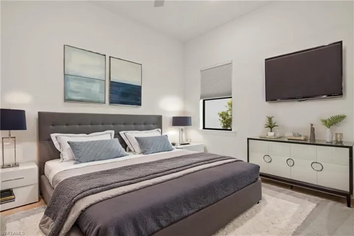 Virtually staged Bedroom with light wood-type flooring