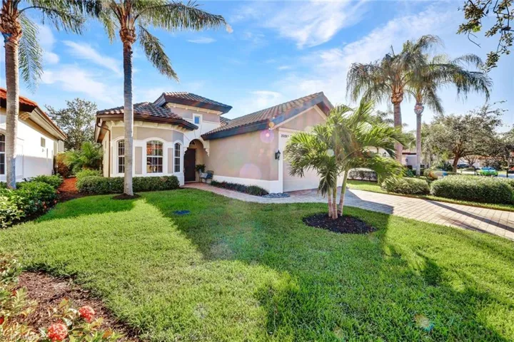 Mediterranean / spanish-style house featuring a front yard