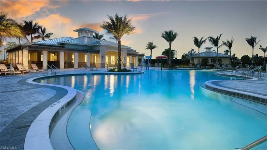 Community pool with a patio