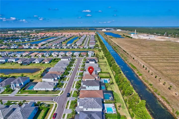 Aerial view featuring a residential view and a water view