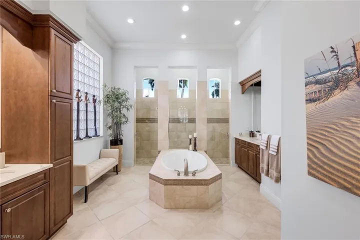 Primary Bath with huge shower, ample storage space, featuring soaking tub and lots of natural light